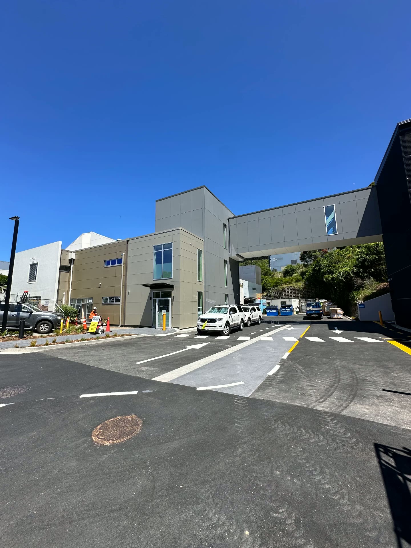Finished multi-building campus exterior with clad walls and link bridge