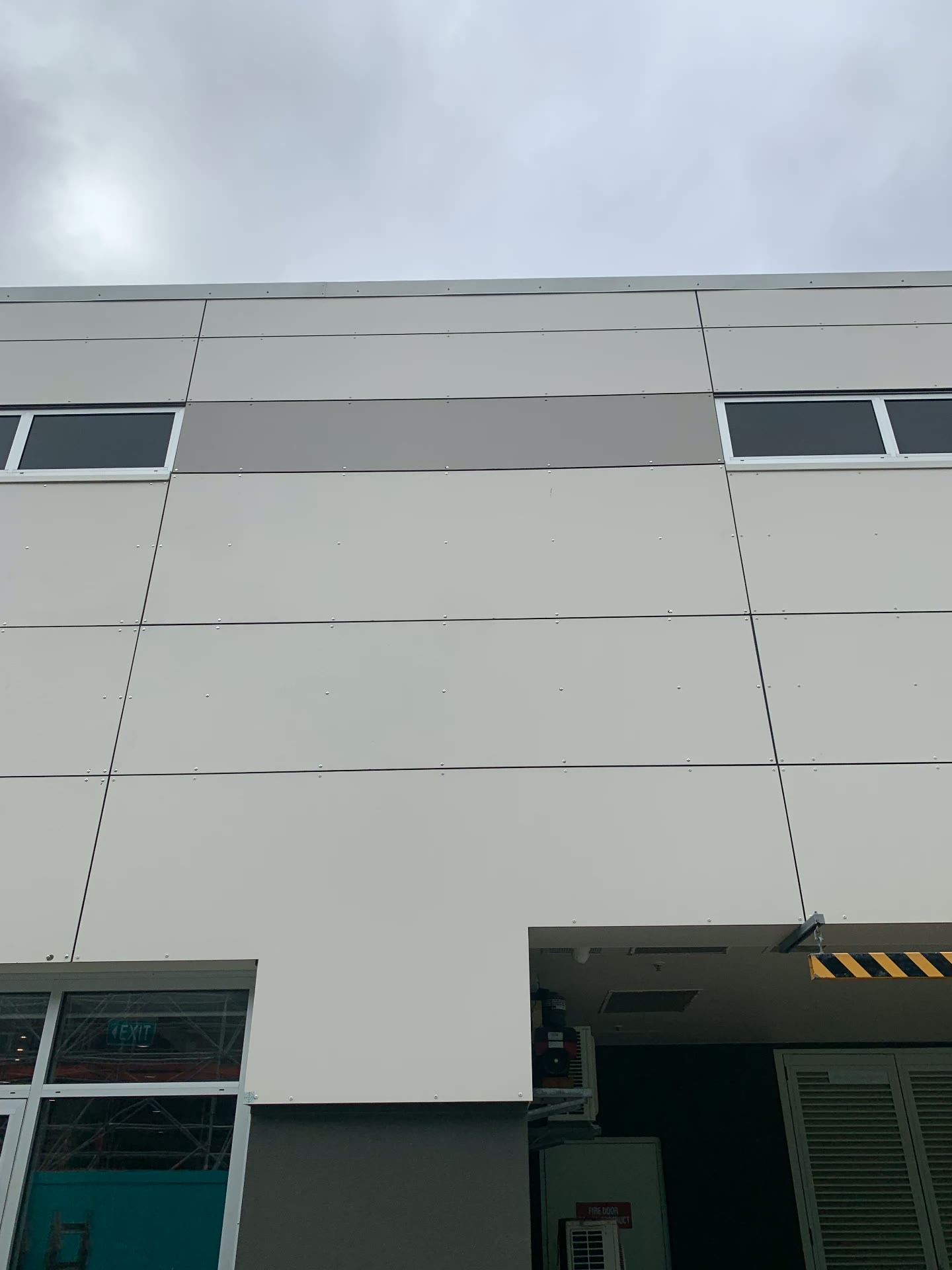 Close detail of flush-fixed exterior wall panels with crisp seams