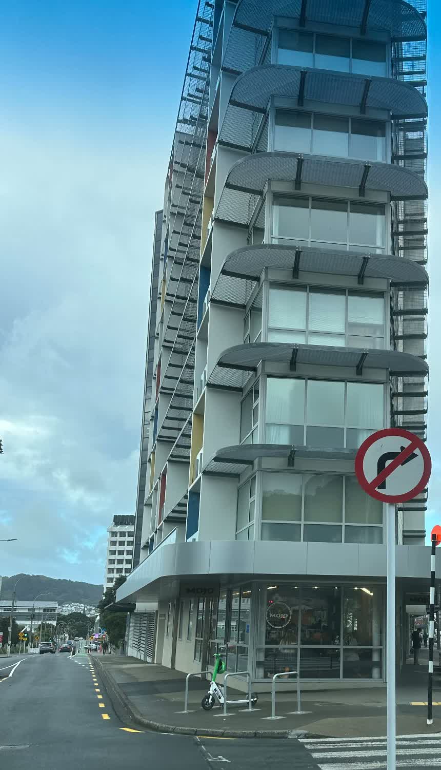 Multi-storey Wellington apartment building with panel cladding and balcony screens